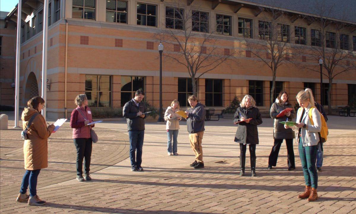 Educators making outdoor observations in an urban setting